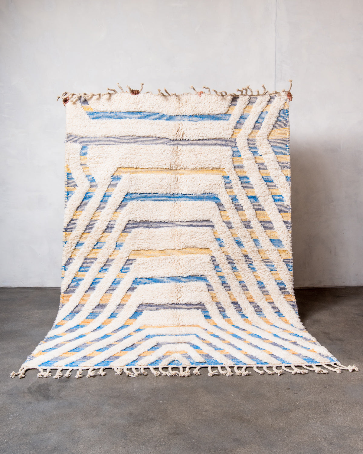 Modern, designer, handcrafted Berber rug from Morocco. Beniourain carpet with beautiful colours and patterns and fluffy wool texture.